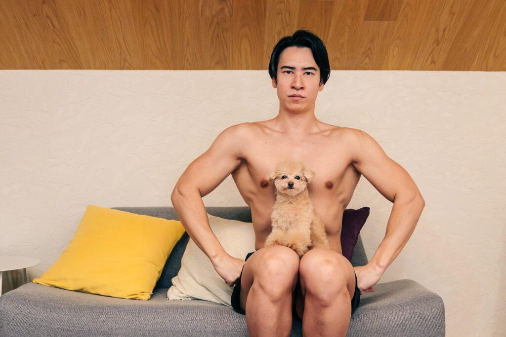 stock photo of dog and muscular men