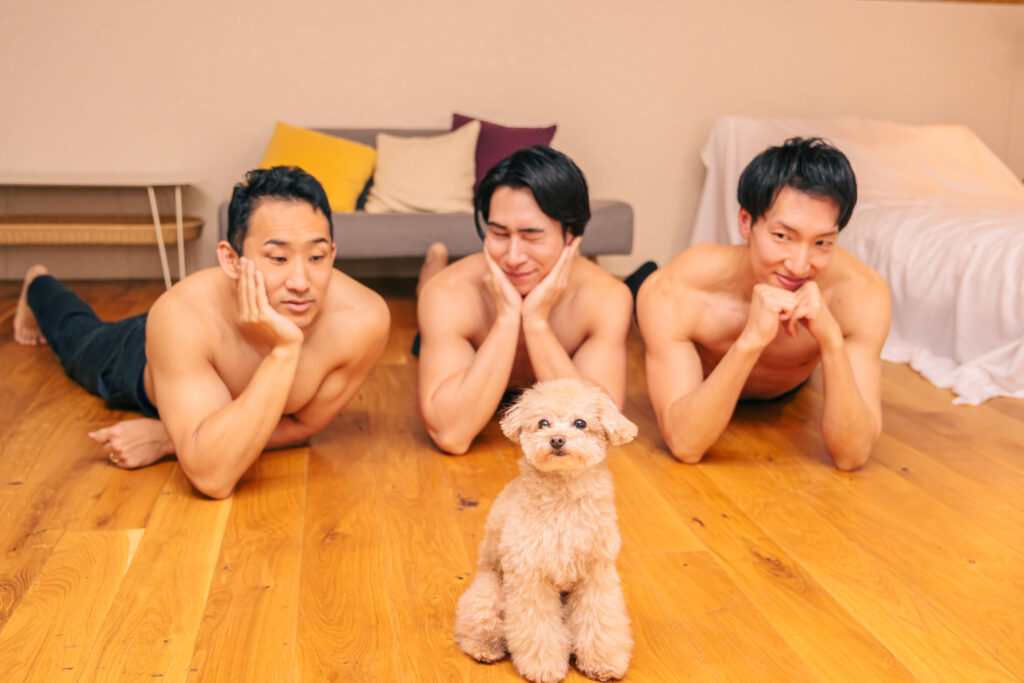 Dog and muscular men